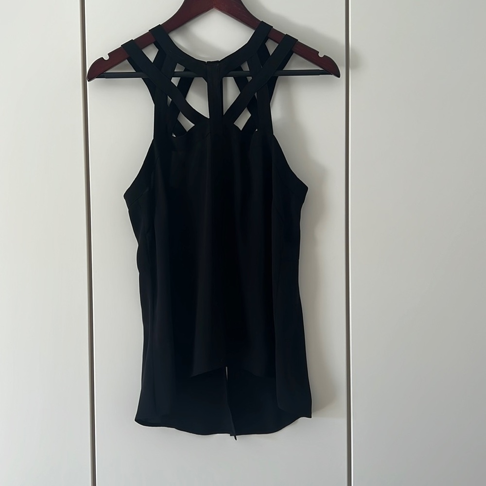 BCBG size small top, black, 100% polyester.